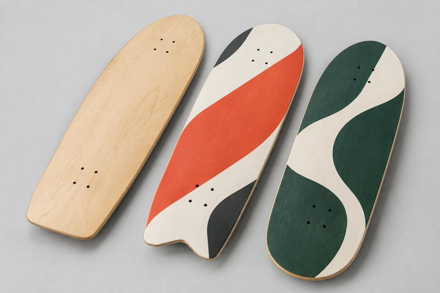 Custom surfskate graphic concepts in natural maple, coral and deep green
