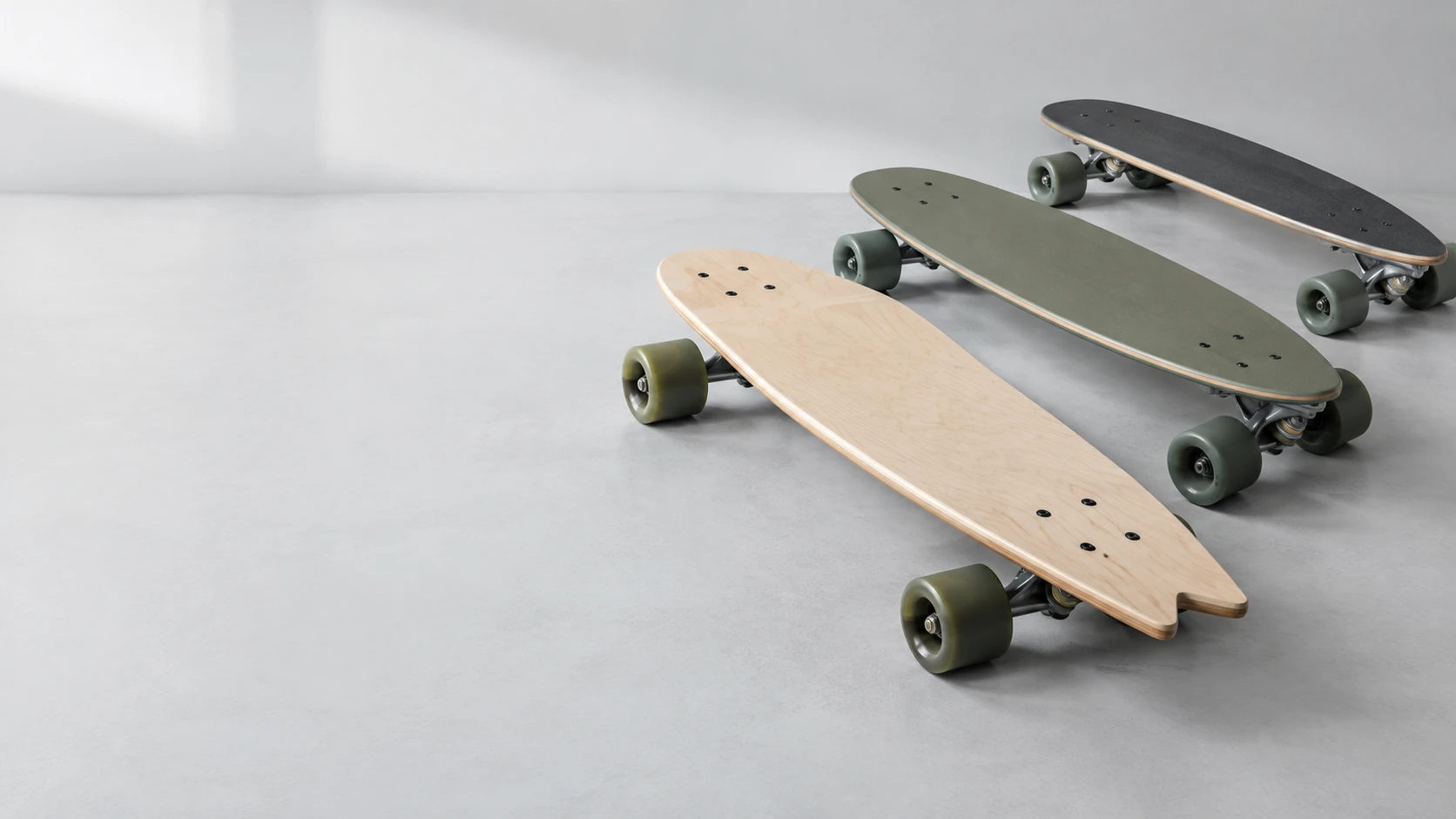 Three unbranded surfskate boards arranged for custom OEM product development